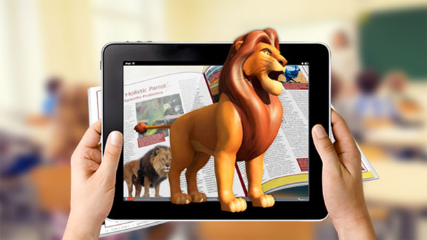 two hands holding a tablet from which a digital illustration of a lion emerges