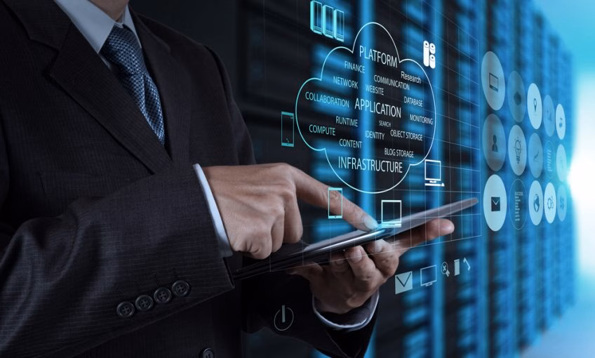 A man in a suit typing on a smartphone