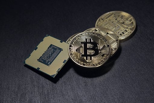 Coins with a bitcoin logo on them and a processor