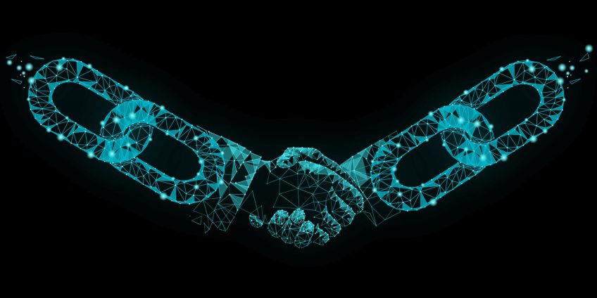 An image showing links of a chain connected by a handshake